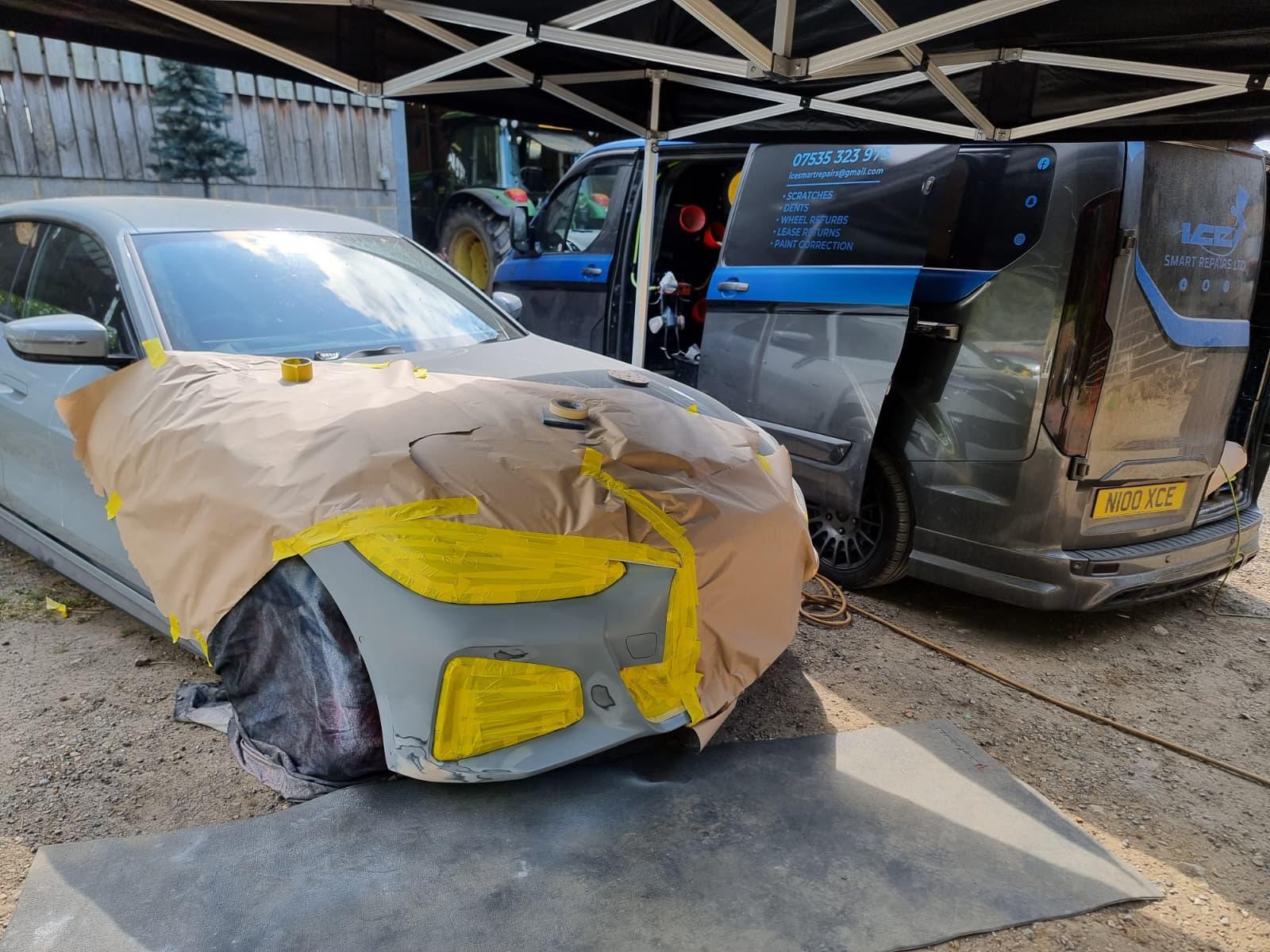 BMW i4 front bumper respray — Masked up